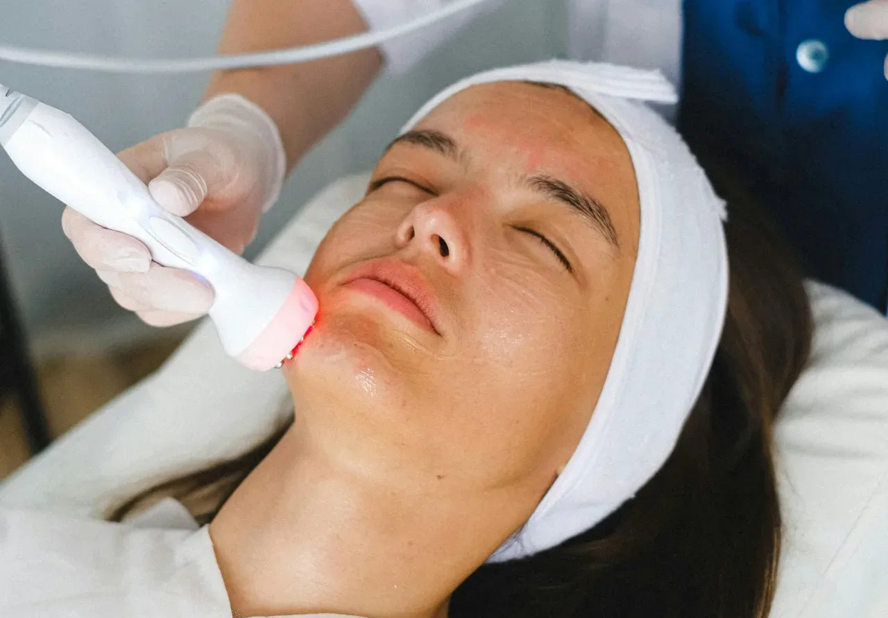 skin rejuvenation woman gets red light therapy treatment